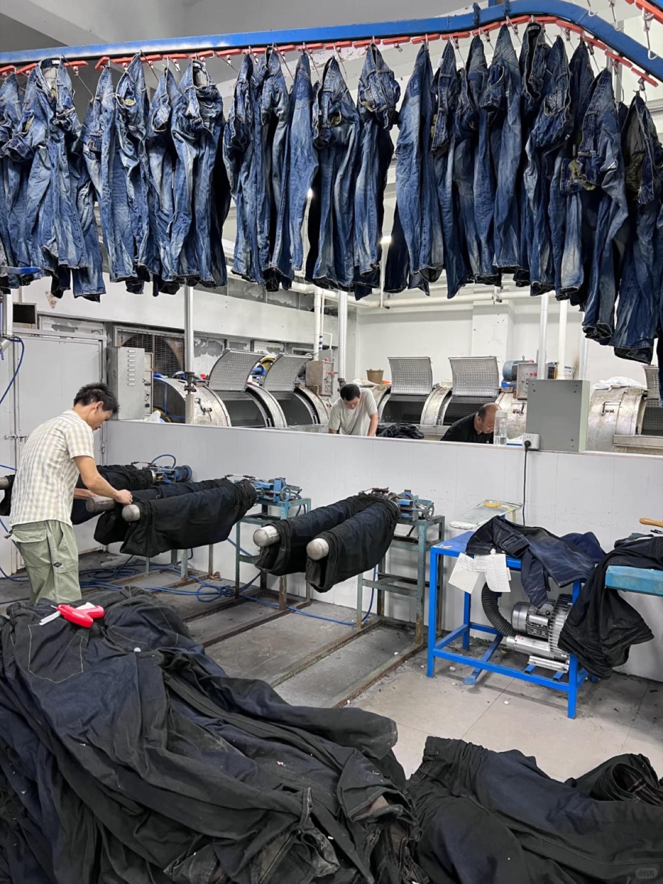 Finished denim hanging on the Topwell finishing line
